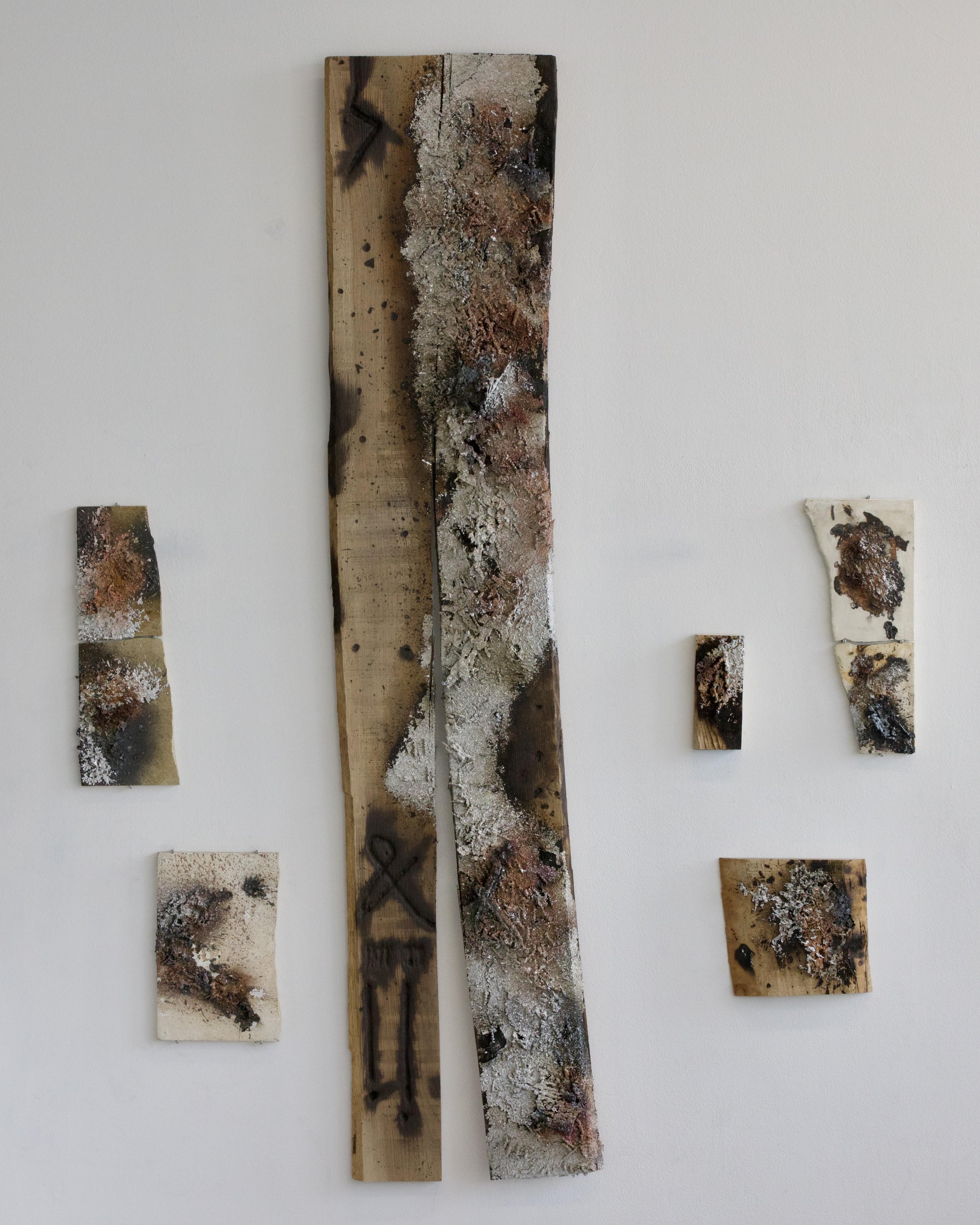 Wall-mounted copper and mixed-media work, gallery installation view