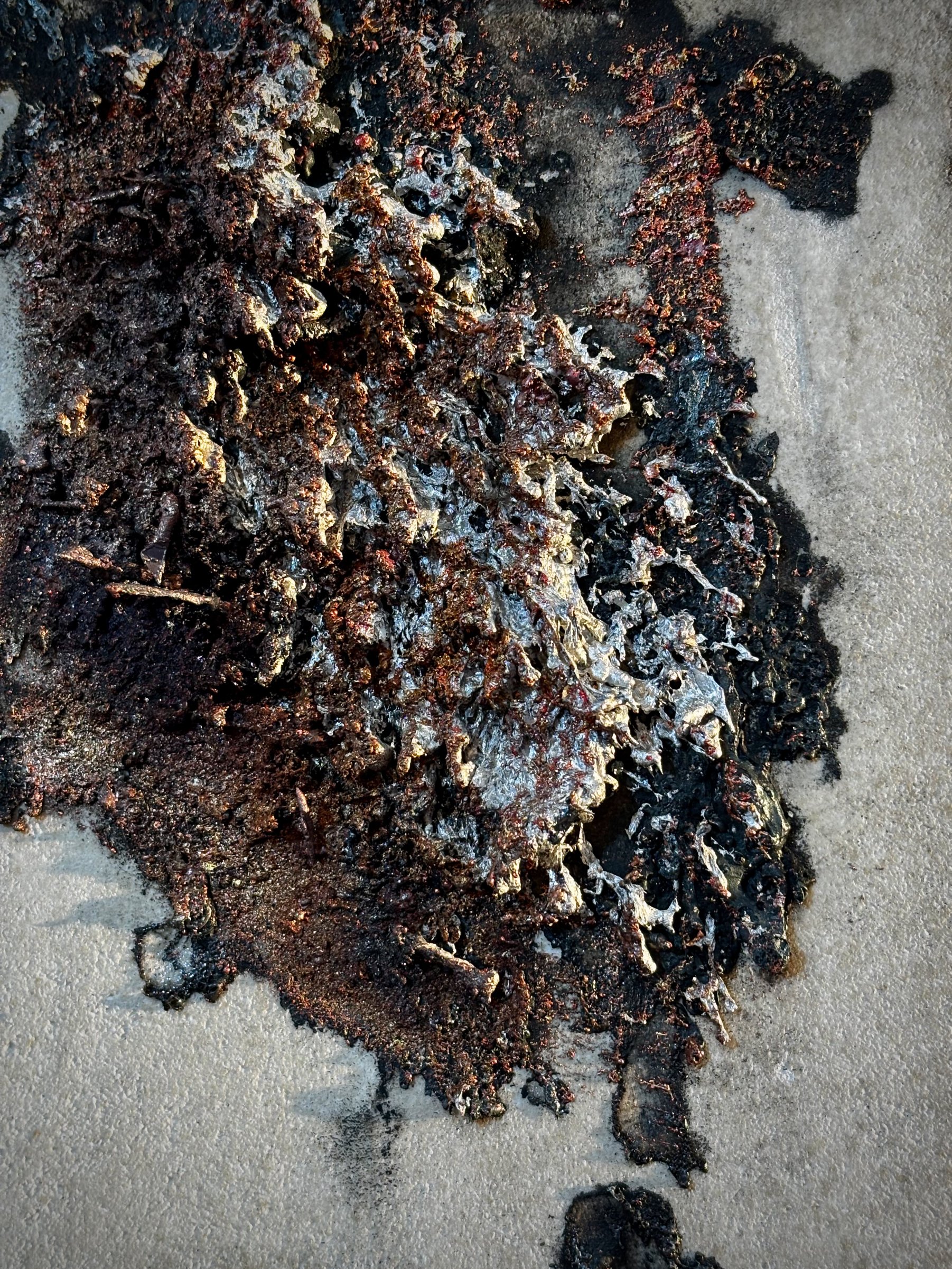Detail of sprayed metal texture on mineral tile