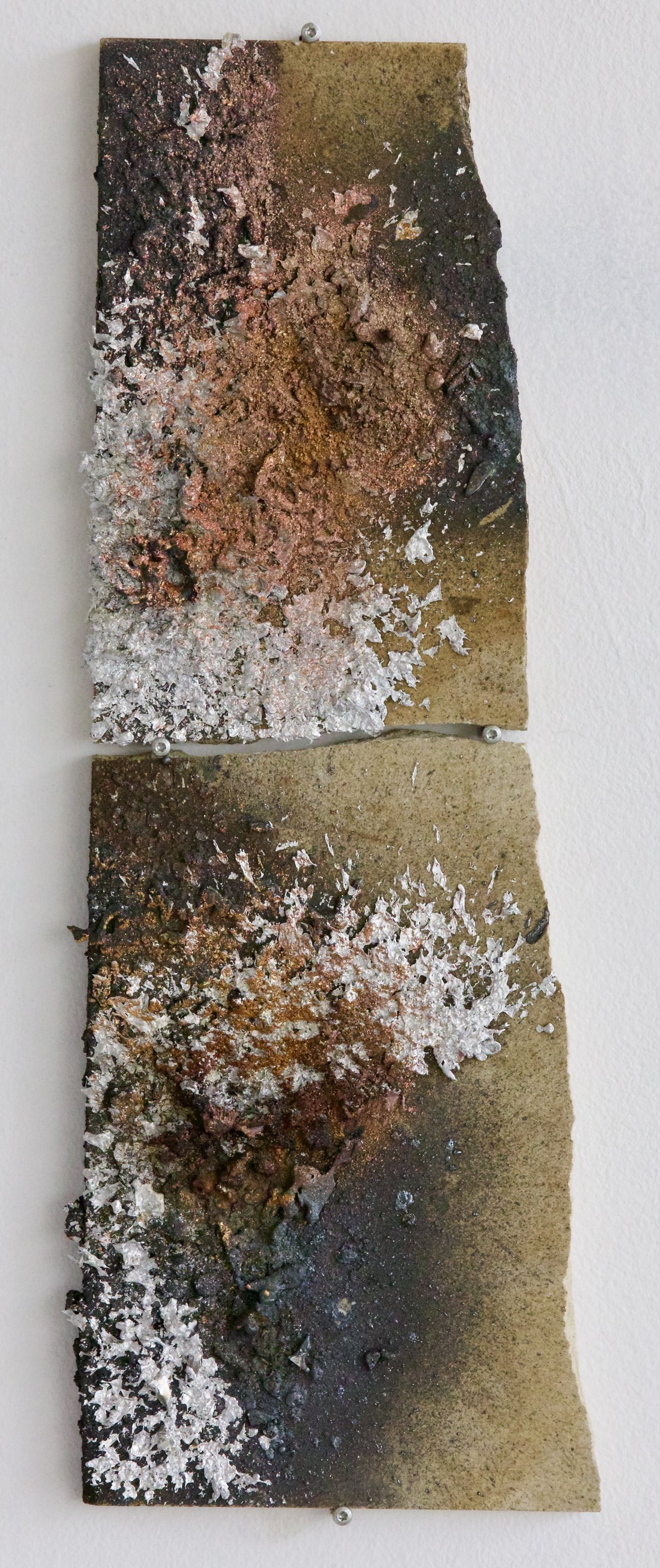 Two stacked mineral panels with rust-copper and aluminium sprayed metal deposits, bolted wall mount